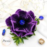 D Anemone Embroidery Design for FSL brooch featuring deep purple petals, a black textured center with a blue crystal, and green leaves.