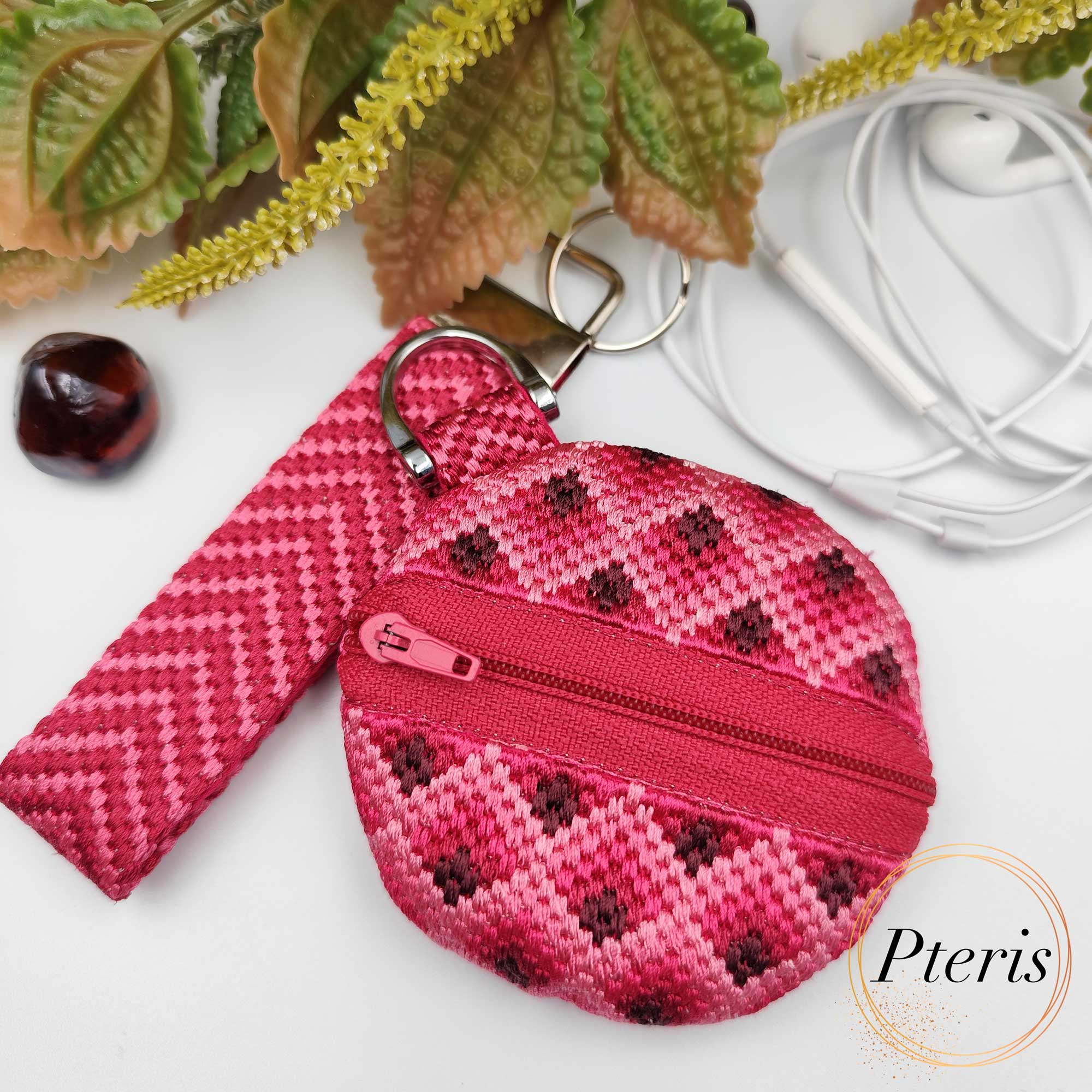 ITH Bargello embroidered round purse with zig-zag pattern and pink zipper