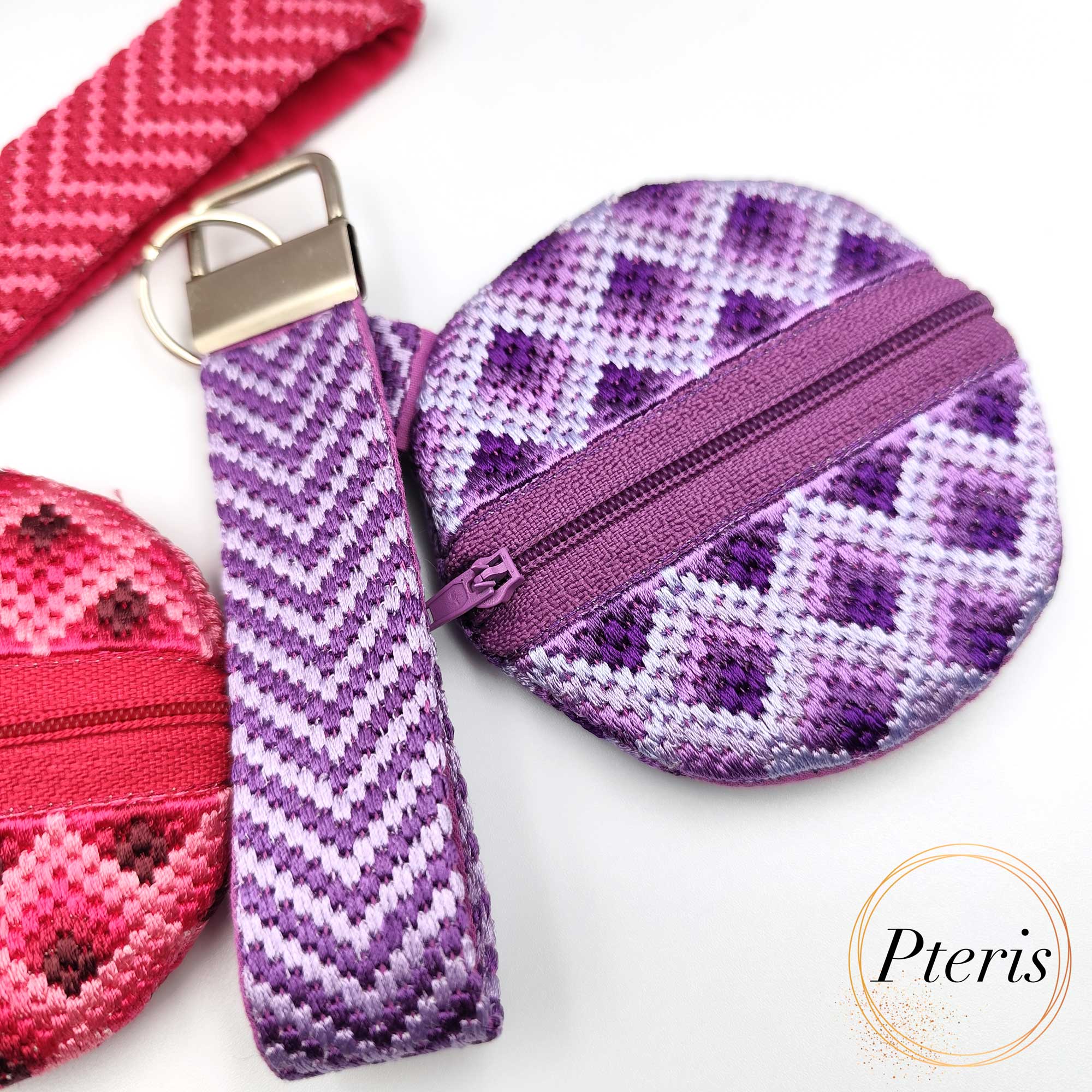 ITH Bargello embroidered round purse with zig-zag pattern and pink zipper