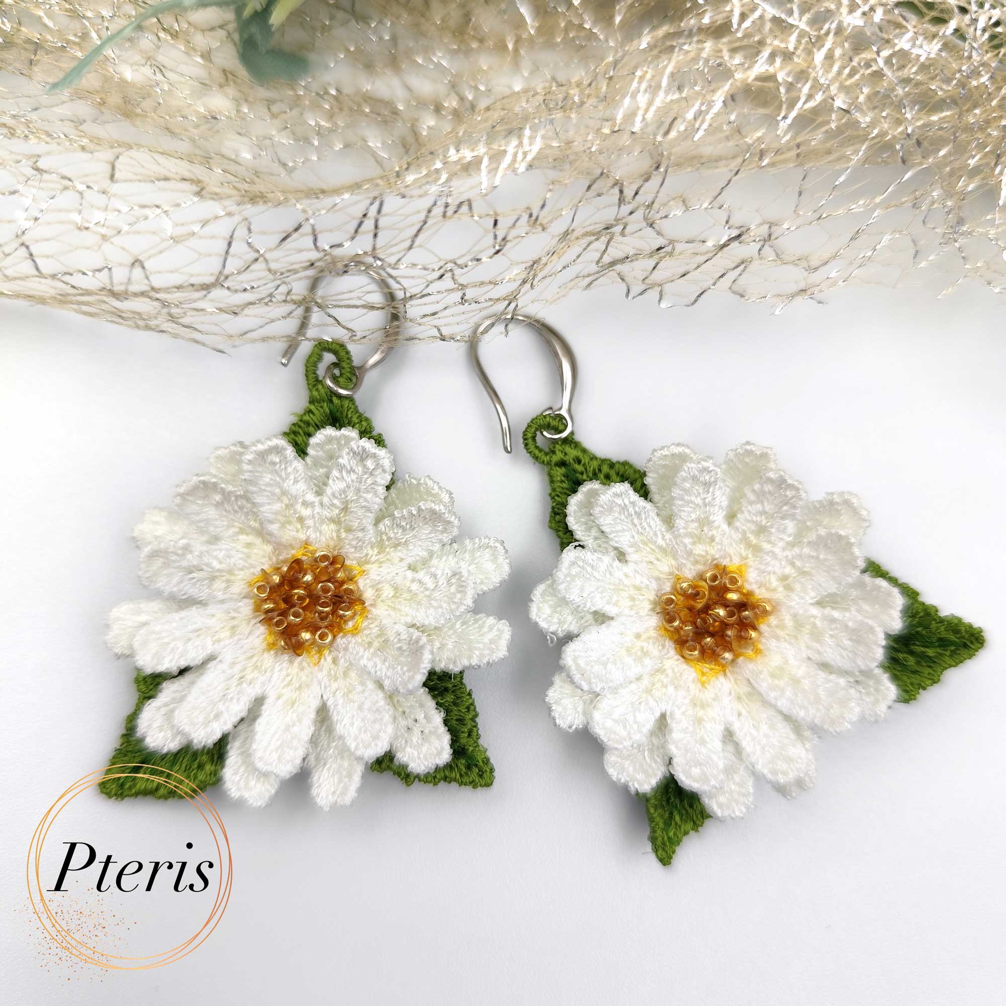Bring the fresh, cheerful spirit of a summer meadow to your jewelry collection with our 3D Daisy Embroidery Design. We specifically developed this Freestanding Lace (FSL) project to help you craft realistic, high-relief daisies that work beautifully as earrings, pendants, or elegant brooches. This versatile 3D Daisy Embroidery Design captures the classic beauty of white petals and golden centers in every stitch.