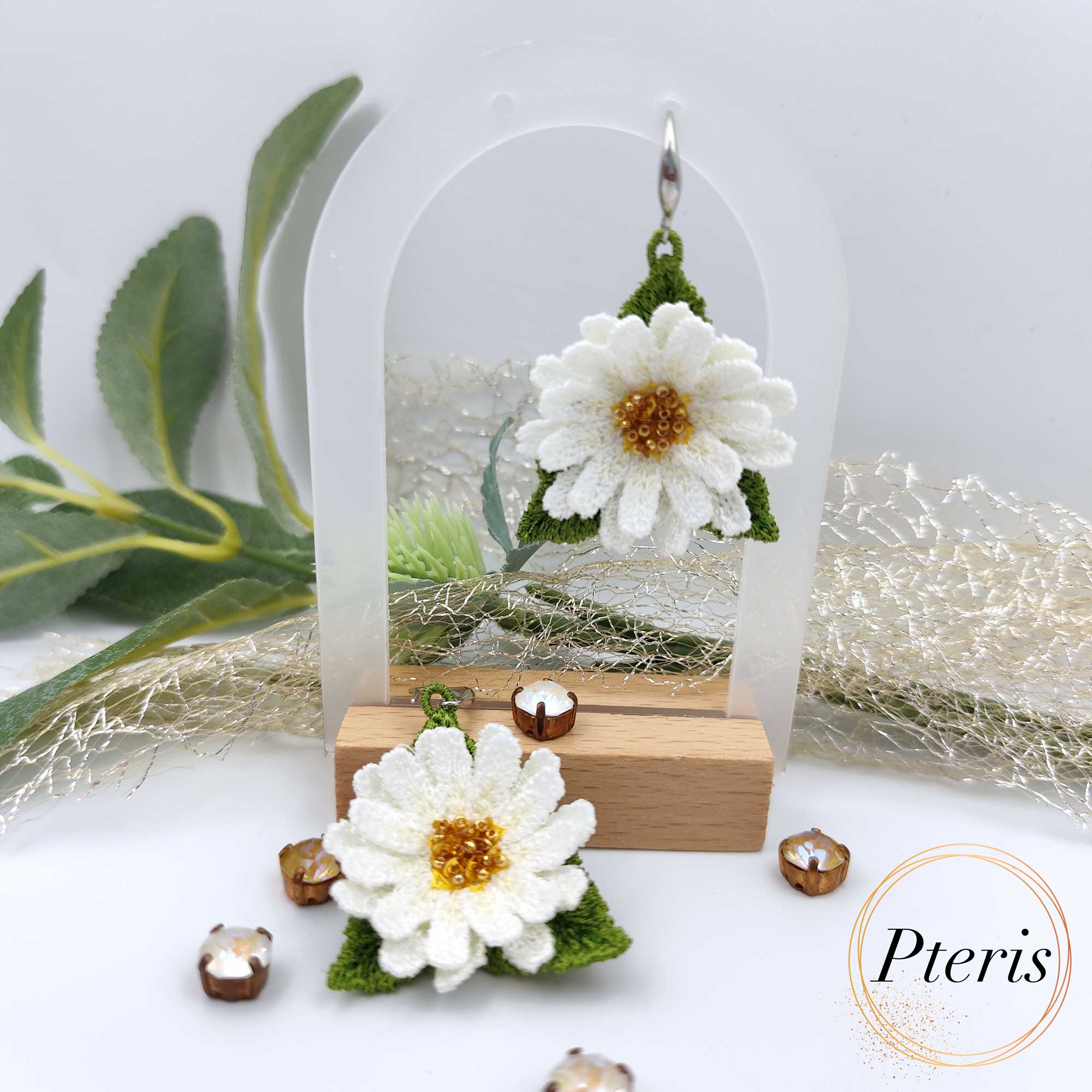 Bring the fresh, cheerful spirit of a summer meadow to your jewelry collection with our 3D Daisy Embroidery Design. We specifically developed this Freestanding Lace (FSL) project to help you craft realistic, high-relief daisies that work beautifully as earrings, pendants, or elegant brooches. This versatile 3D Daisy Embroidery Design captures the classic beauty of white petals and golden centers in every stitch.