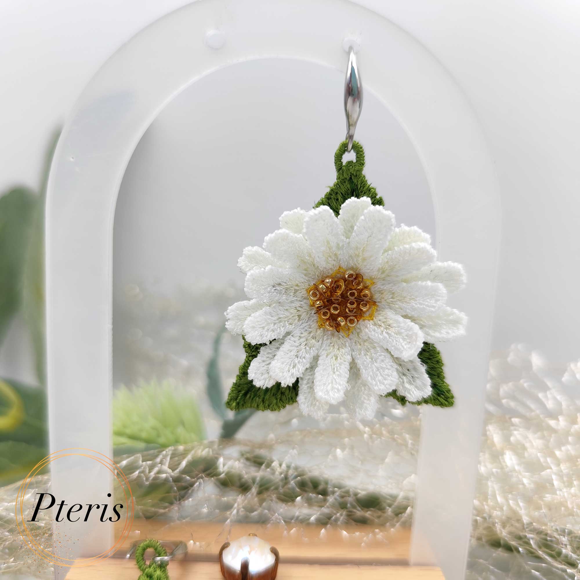 Bring the fresh, cheerful spirit of a summer meadow to your jewelry collection with our 3D Daisy Embroidery Design. We specifically developed this Freestanding Lace (FSL) project to help you craft realistic, high-relief daisies that work beautifully as earrings, pendants, or elegant brooches. This versatile 3D Daisy Embroidery Design captures the classic beauty of white petals and golden centers in every stitch.