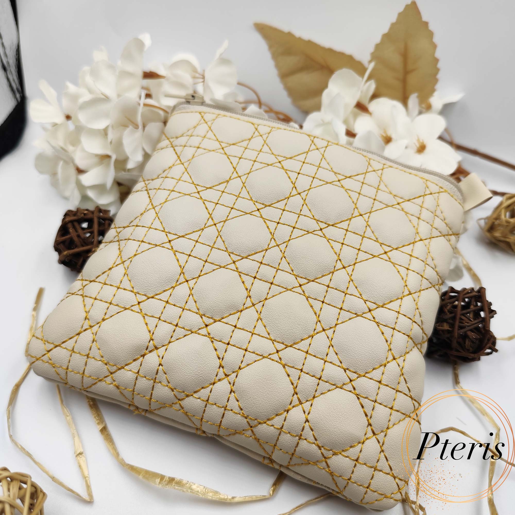 Square Quilted Zipper Pouch ITH embroidery design in cream leather with gold thread