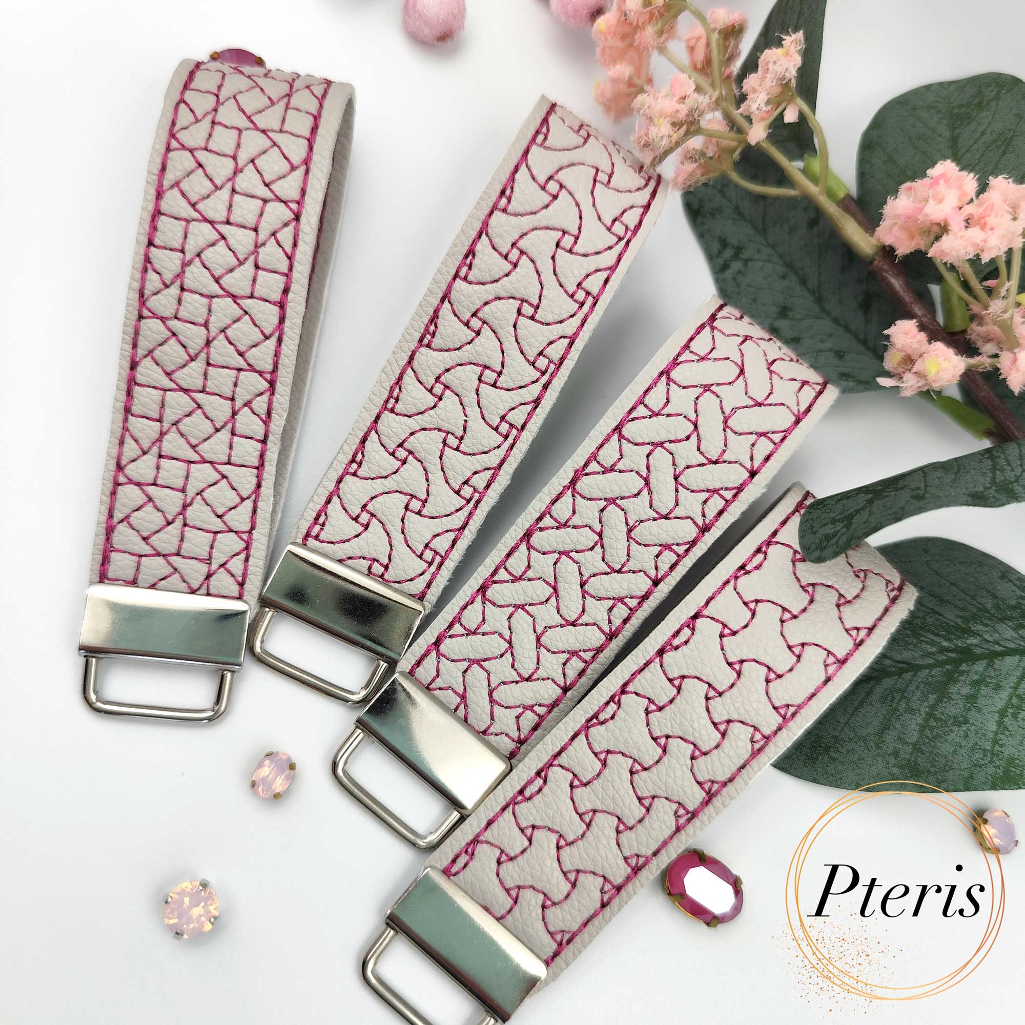 ITH Geometric Quilted Key Fob embroidery design on grey faux leather with magenta stitching