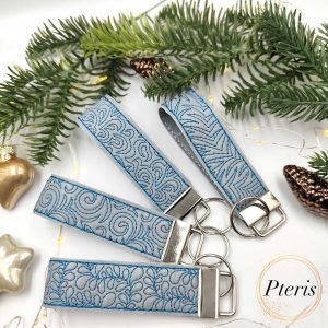 ITH Geometric Ornament Wrist Strap Key Fob embroidery design on lilac faux leather
