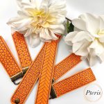 ITH Geometric Wrist Strap Key Fob embroidery design on orange and purple faux leather