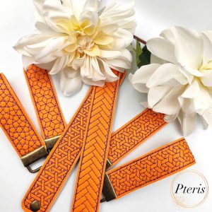 ITH Geometric Wrist Strap Key Fob embroidery design on orange and purple faux leather