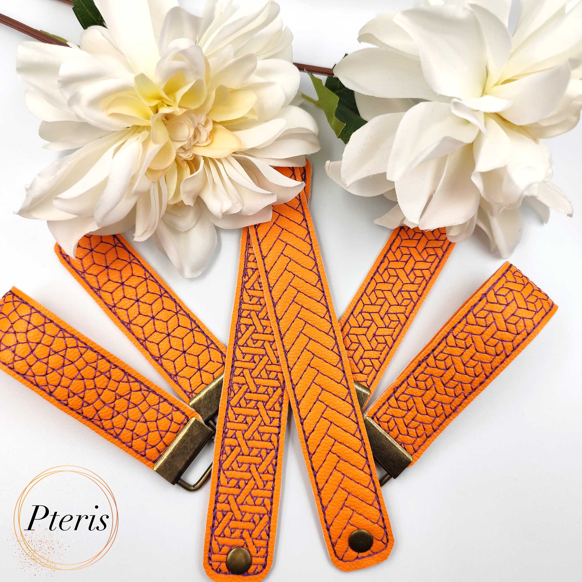 ITH Geometric Wrist Strap Key Fob embroidery design on orange and purple faux leather