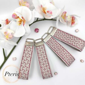 ITH Geometric Quilted Key Fob embroidery design on grey faux leather with magenta stitching