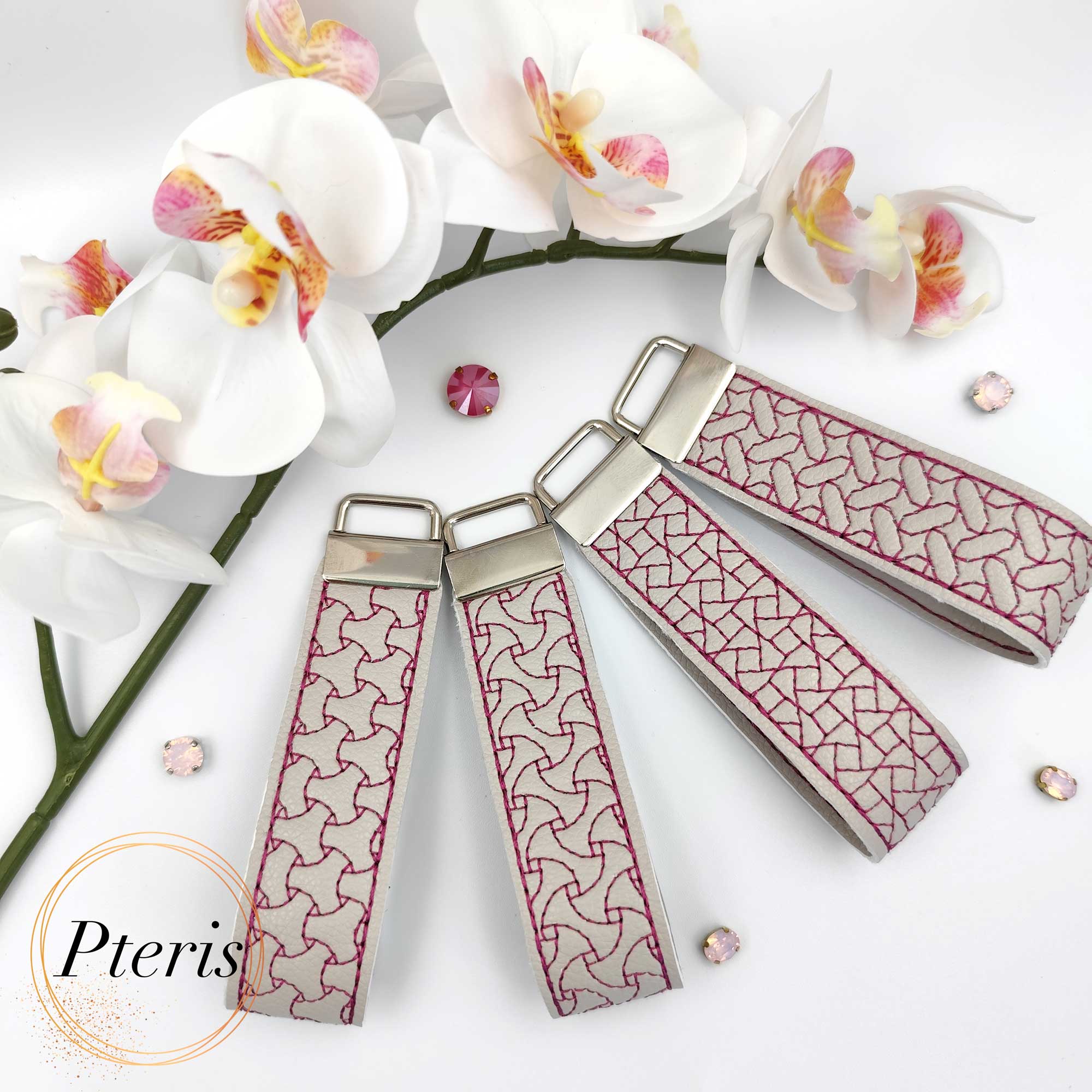 ITH Geometric Quilted Key Fob embroidery design on grey faux leather with magenta stitching