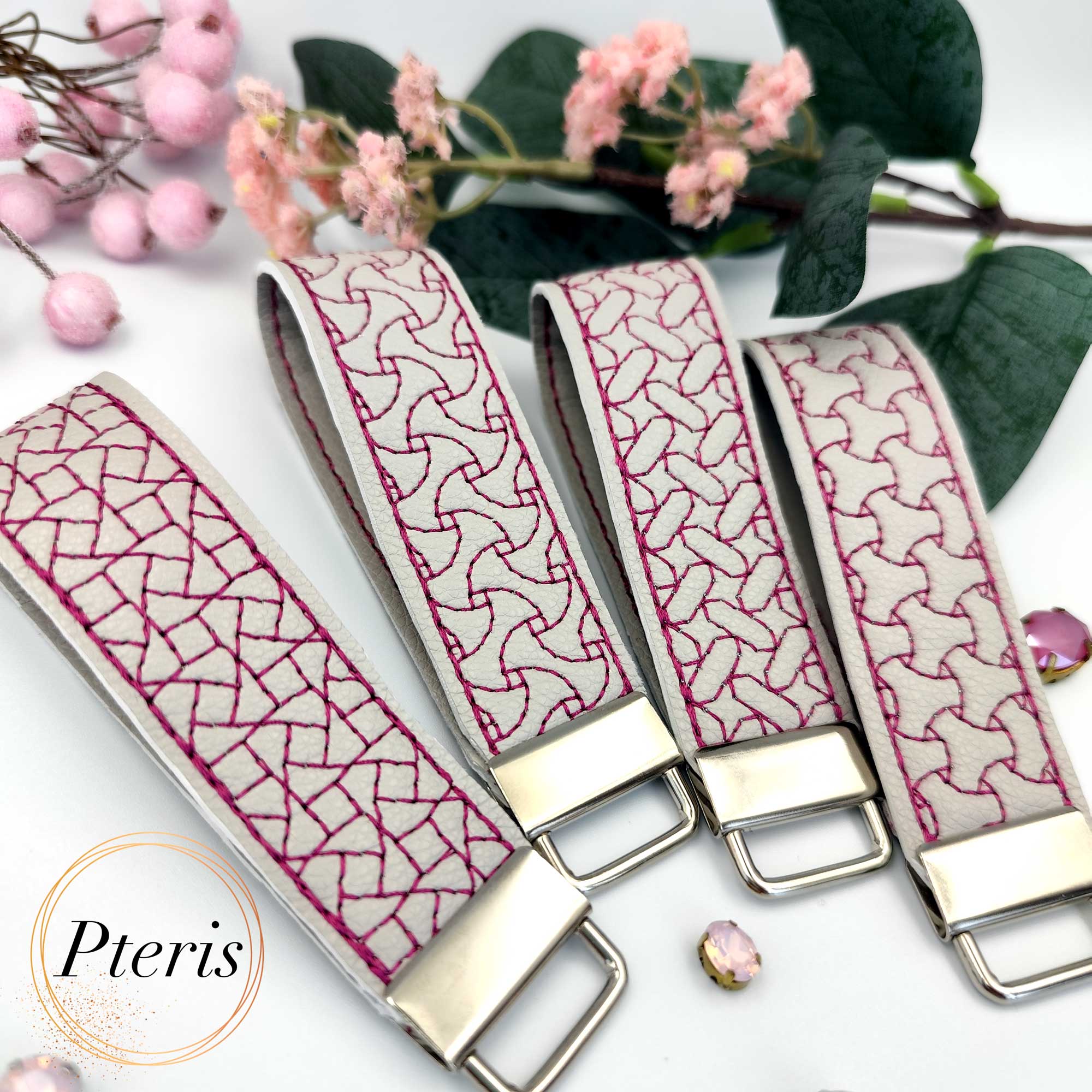 ITH Geometric Quilted Key Fob embroidery design on grey faux leather with magenta stitching