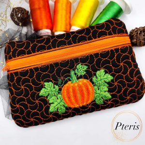 Add a festive touch to your autumn décor with our Fringed Pumpkin Zipper Pouch ITH design. The standout feature of this bag is the central pumpkin motif, created using a specialized fringe technique that gives the pumpkin a soft, 3D textured appearance. Complemented by vibrant green leaves and a unique swirling quilt pattern that mimics vines, this pouch is a masterpiece of seasonal embroidery.