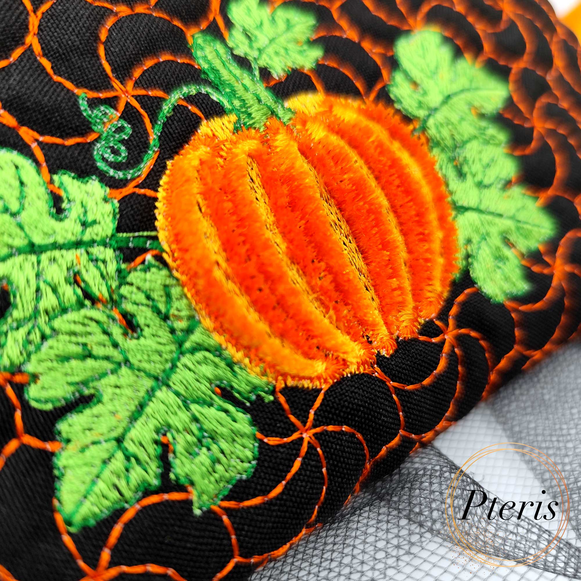 Add a festive touch to your autumn décor with our Fringed Pumpkin Zipper Pouch ITH design. The standout feature of this bag is the central pumpkin motif, created using a specialized fringe technique that gives the pumpkin a soft, 3D textured appearance. Complemented by vibrant green leaves and a unique swirling quilt pattern that mimics vines, this pouch is a masterpiece of seasonal embroidery.