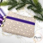 ITH Star Quilted Zipper Bag embroidery design with purple geometric stitching on cream leather