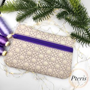 ITH Star Quilted Zipper Bag embroidery design with purple geometric stitching on cream leather