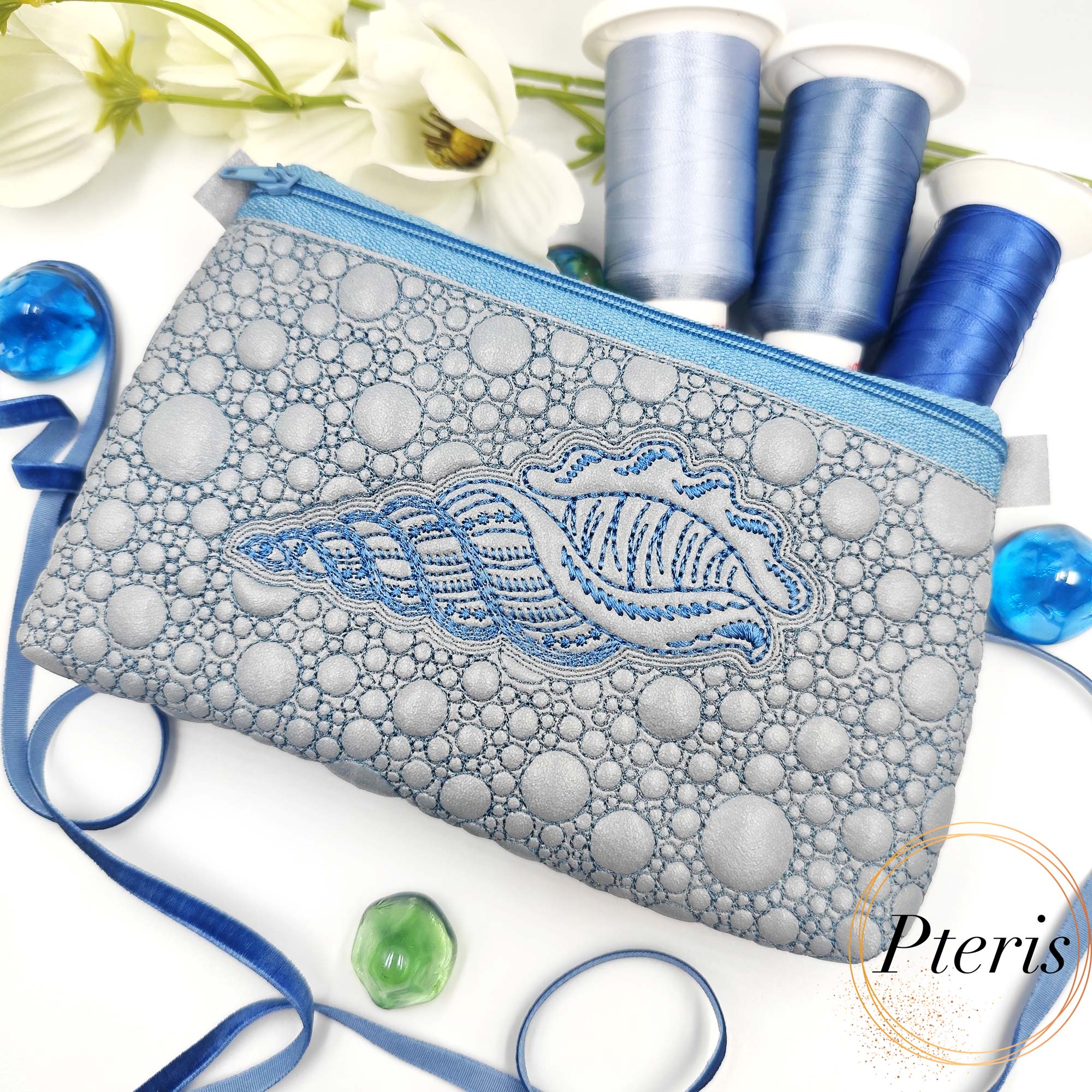 ITH Sea Shell Zipper Pouch embroidery design on silver faux leather