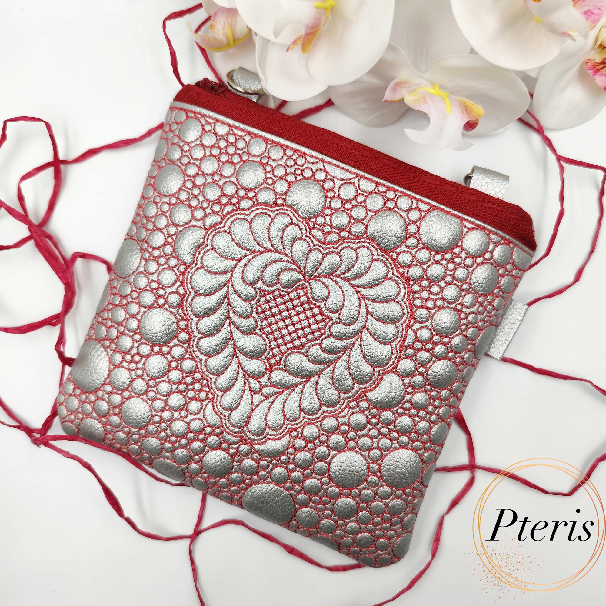 ITH Quilted Heart Square Pouch embroidery design in silver leather with red stitching