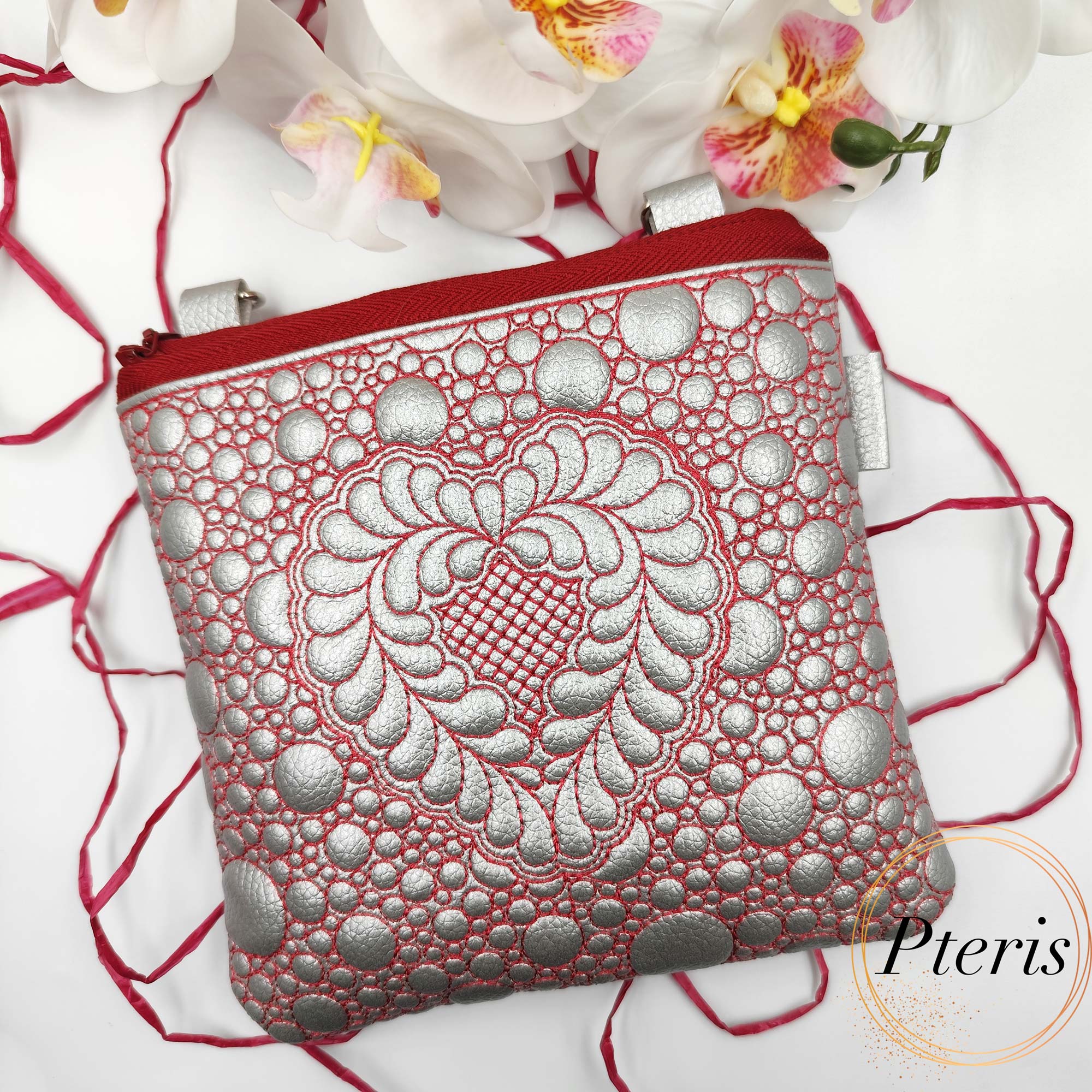 ITH Quilted Heart Square Pouch embroidery design in silver leather with red stitching