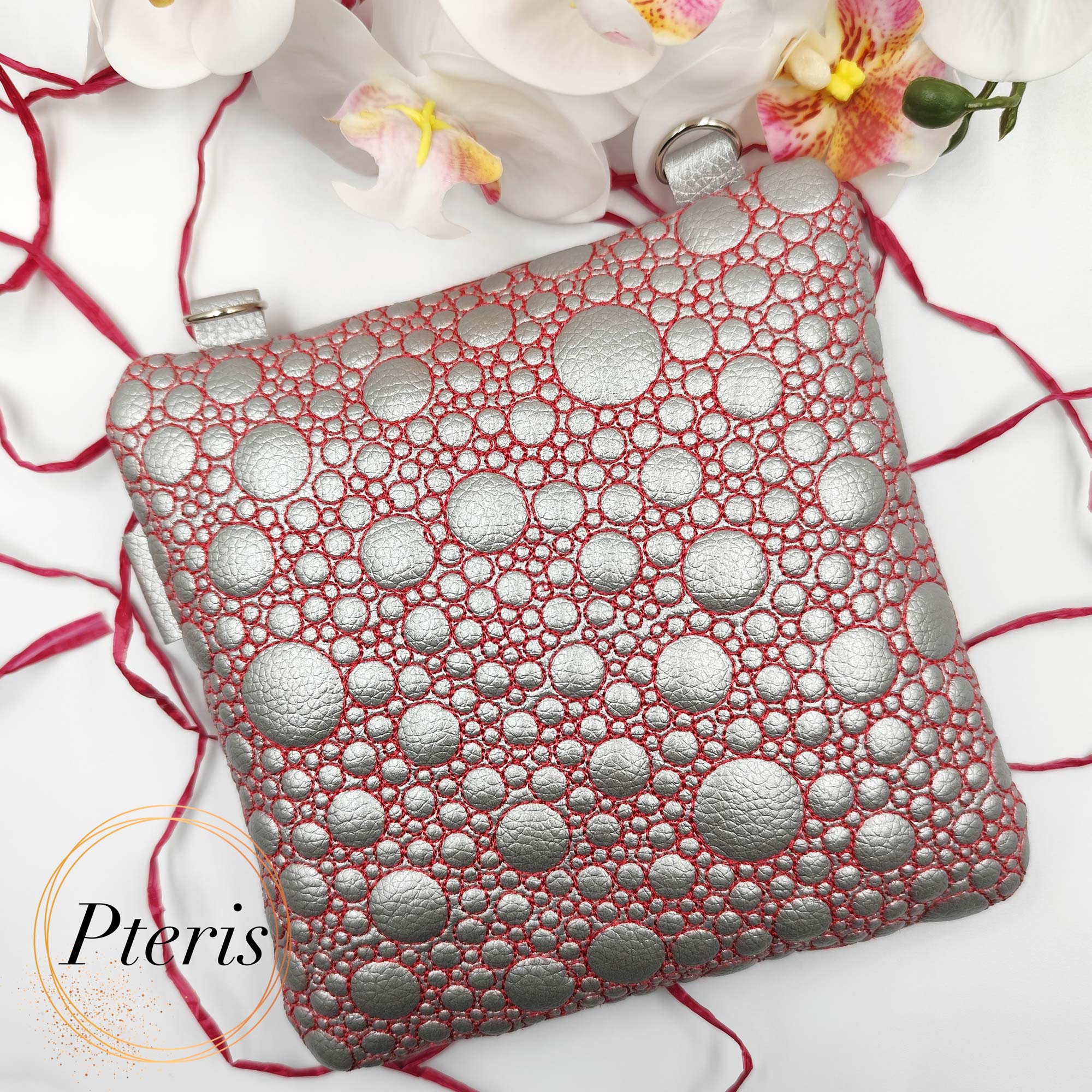 ITH Quilted Heart Square Pouch embroidery design in silver leather with red stitching