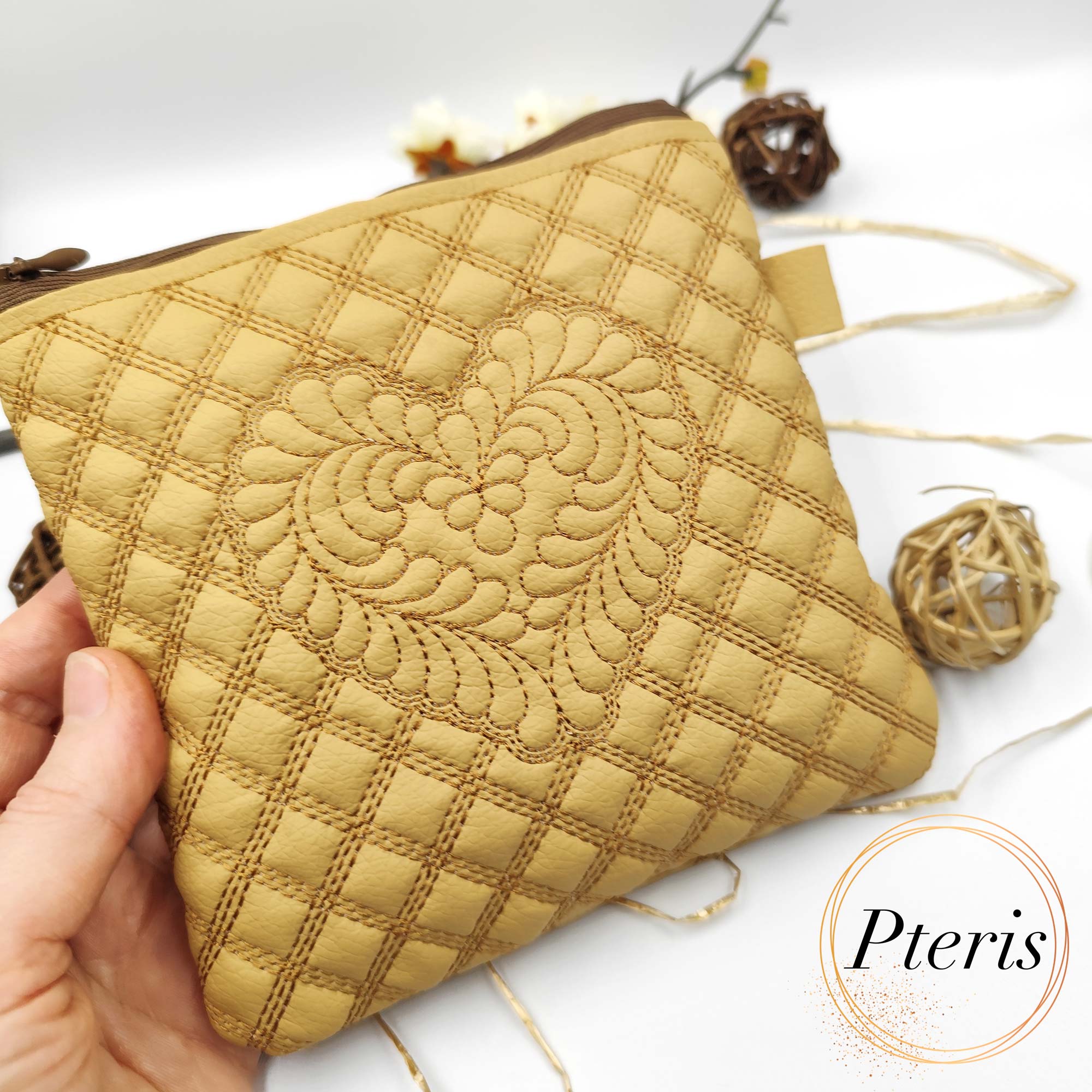 ITH Quilted Feather Heart Square Pouch embroidery design on tan leather