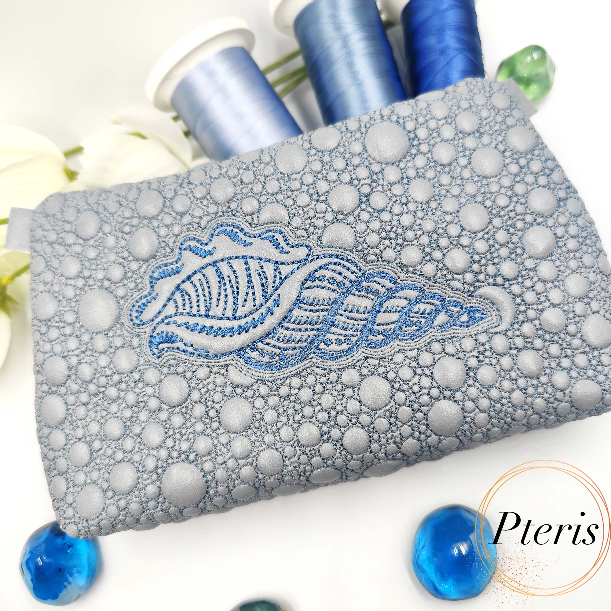 ITH Sea Shell Zipper Pouch embroidery design on silver faux leather