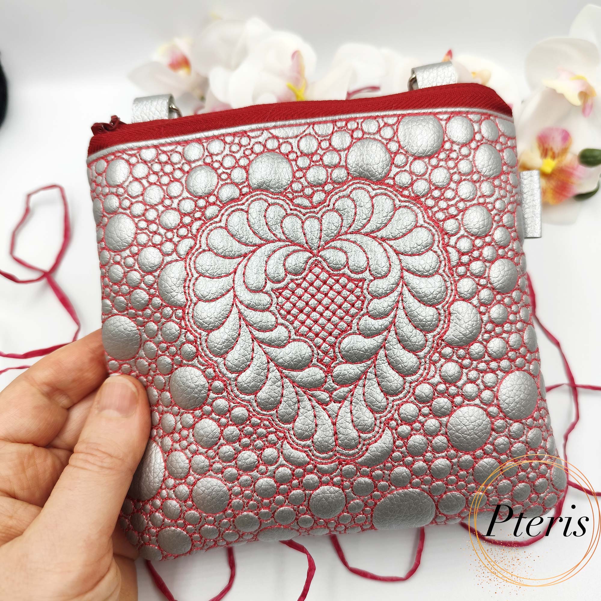 ITH Quilted Heart Square Pouch embroidery design in silver leather with red stitching