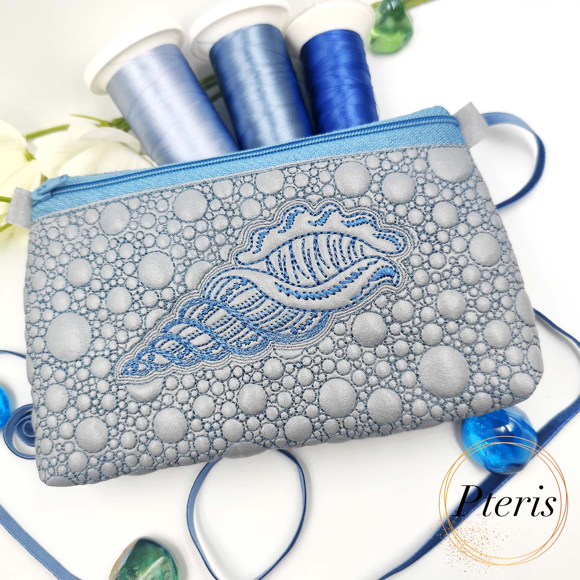 ITH Sea Shell Zipper Pouch embroidery design on silver faux leather