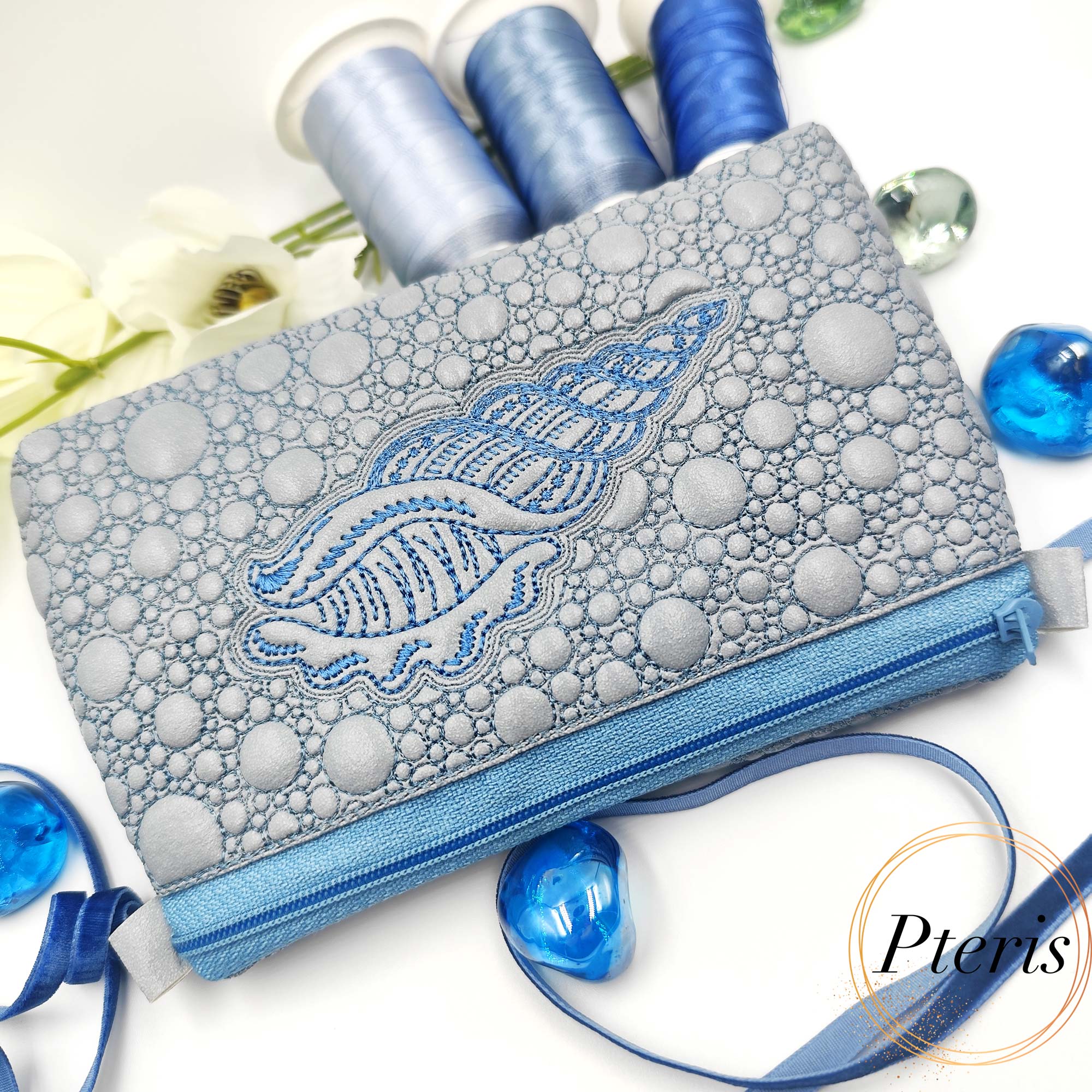 ITH Sea Shell Zipper Pouch embroidery design on silver faux leather
