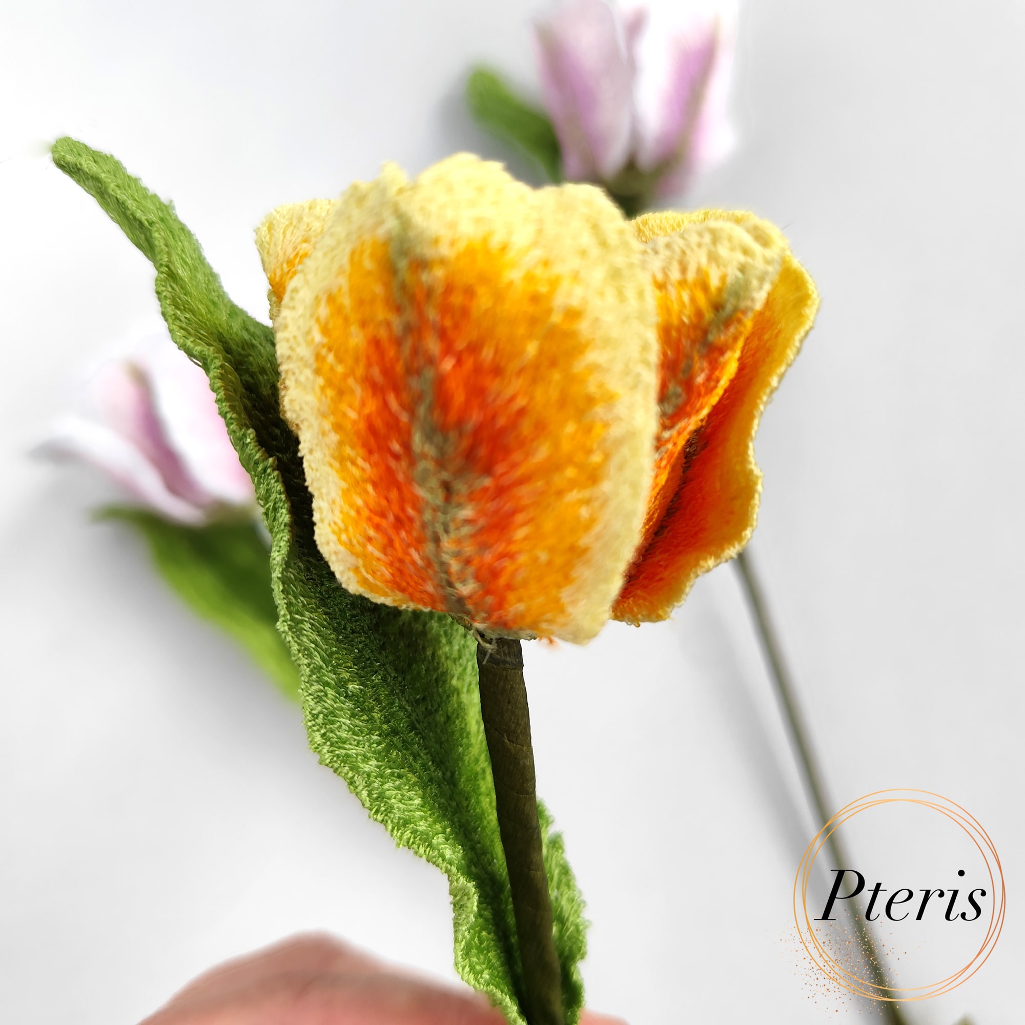 3D Tulip Embroidery Design featuring lifelike embroidered tulips in yellow-orange and pink-white gradients with textured green leaves.