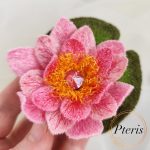 FSL 3D Water Lily brooch machine embroidery design with pink gradient petals, yellow stamens, and a green leaf pad.