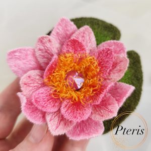 FSL 3D Water Lily brooch machine embroidery design with pink gradient petals, yellow stamens, and a green leaf pad.