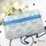 ITH Ornamental Zipper Pouch embroidery design with blue scroll pattern on pearl leather