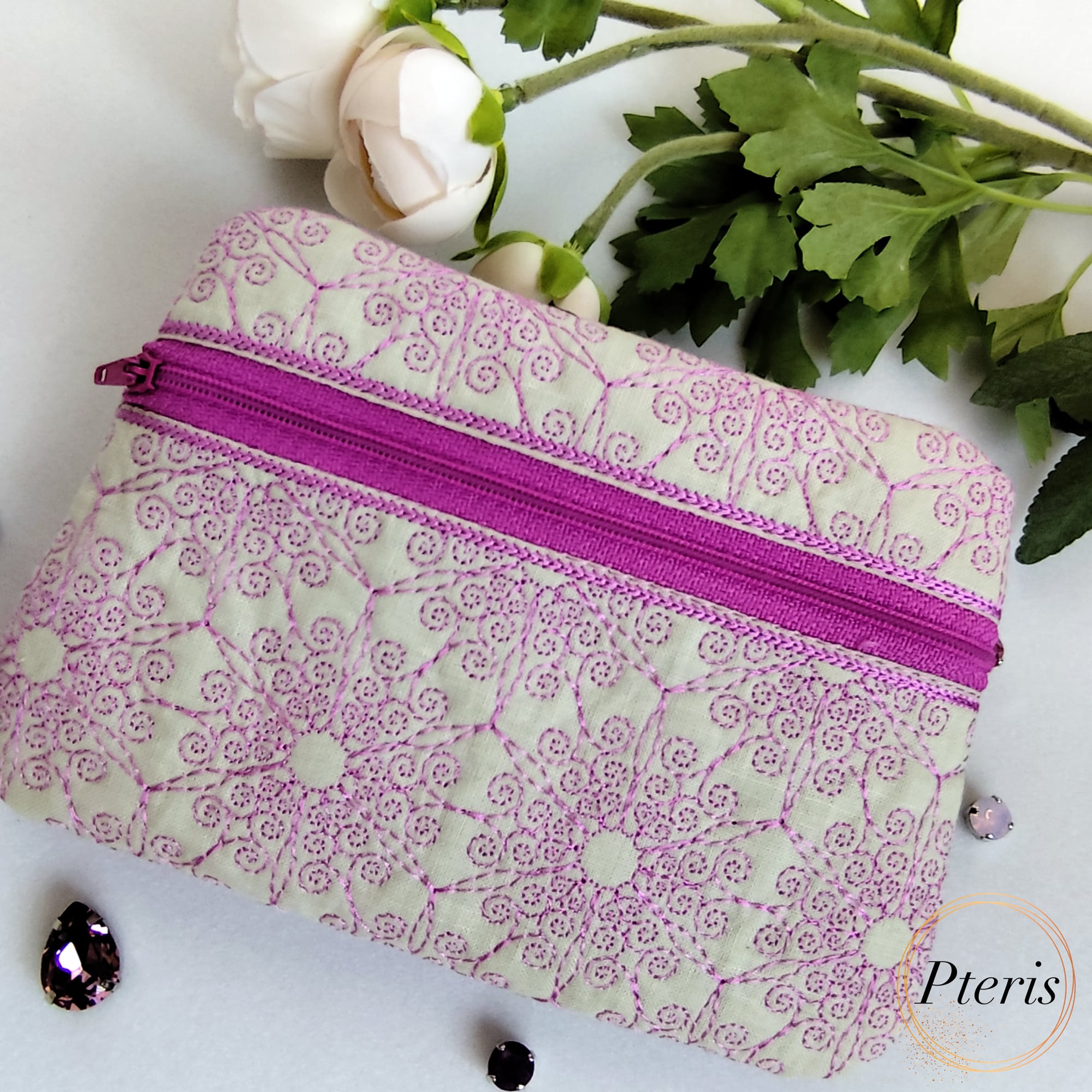 ITH Ornamental Zipper Pouch embroidery design with blue scroll pattern on pearl leather