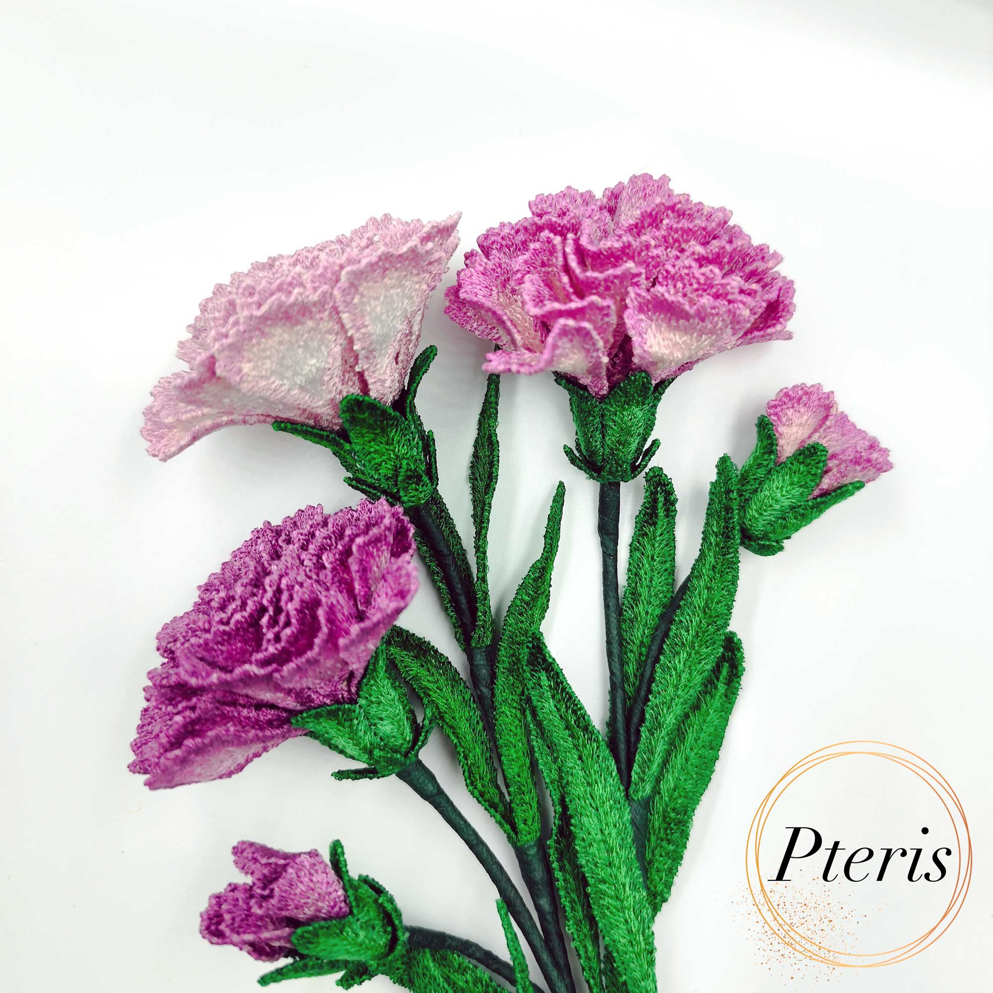 3D Carnation FSL Embroidery Design showing a realistic bouquet of purple and pink embroidered carnations with green leaves and buds on a white background.