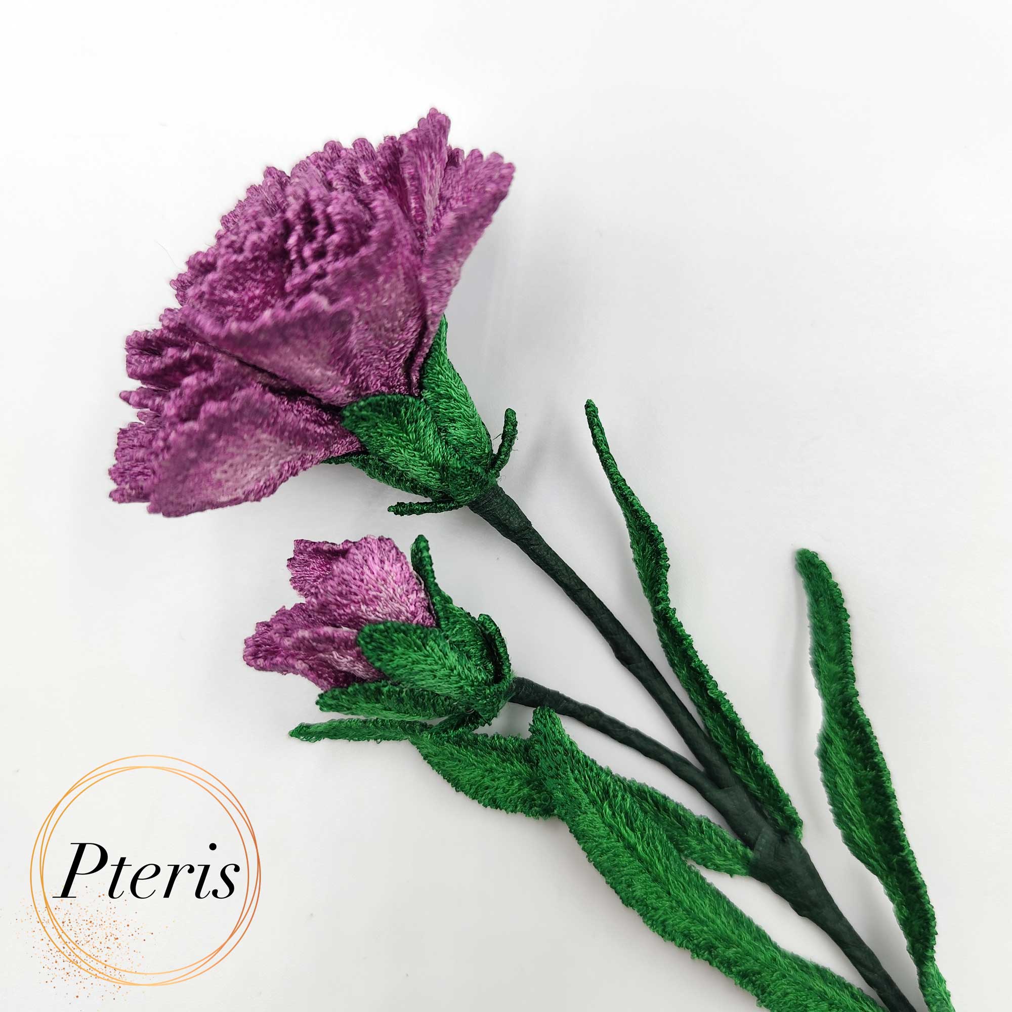 3D Carnation FSL Embroidery Design showing a realistic bouquet of purple and pink embroidered carnations with green leaves and buds on a white background.