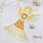 FSL Lace Angel Suncatcher embroidery design featuring a white and yellow freestanding lace angel with a heart at its center, styled with fairy lights and pearls on a white background.