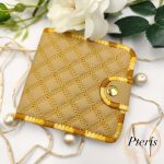 ITH Quilted Wallet embroidery design showing a handmade bifold wallet with blue diamond quilting, credit card slots, and a bill compartment, styled with a blue thread spool.