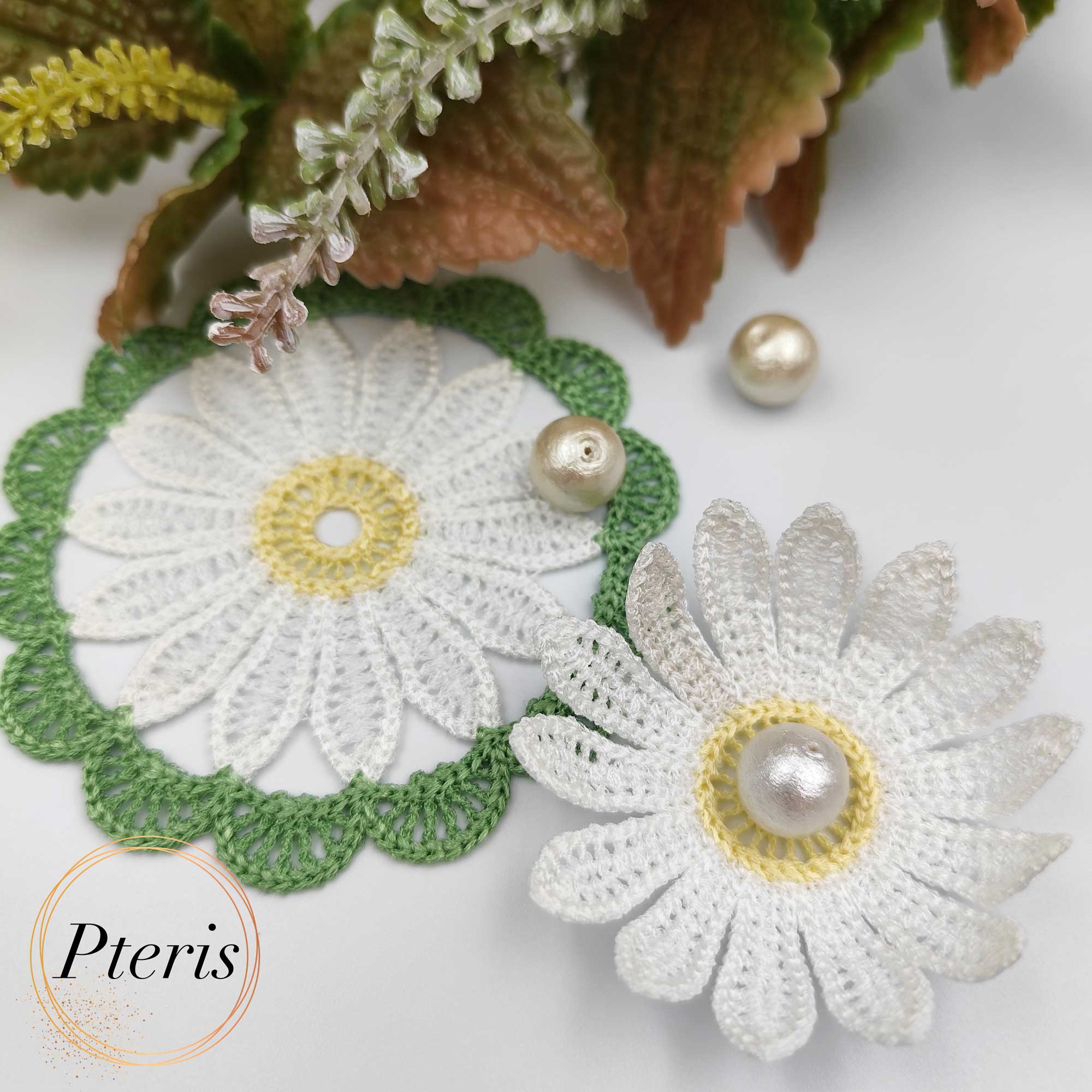FSL 3D Daisy Embroidery Design featuring three crochet-style doilies in white, pink, and blue with 3D petals and pearl centers, arranged on a white background with green lace borders