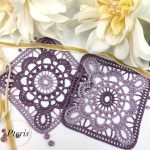 FSL Granny Square Crochet Design featuring two square freestanding lace coasters in shades of purple gradient, styled with white flowers and a gold ribbon.