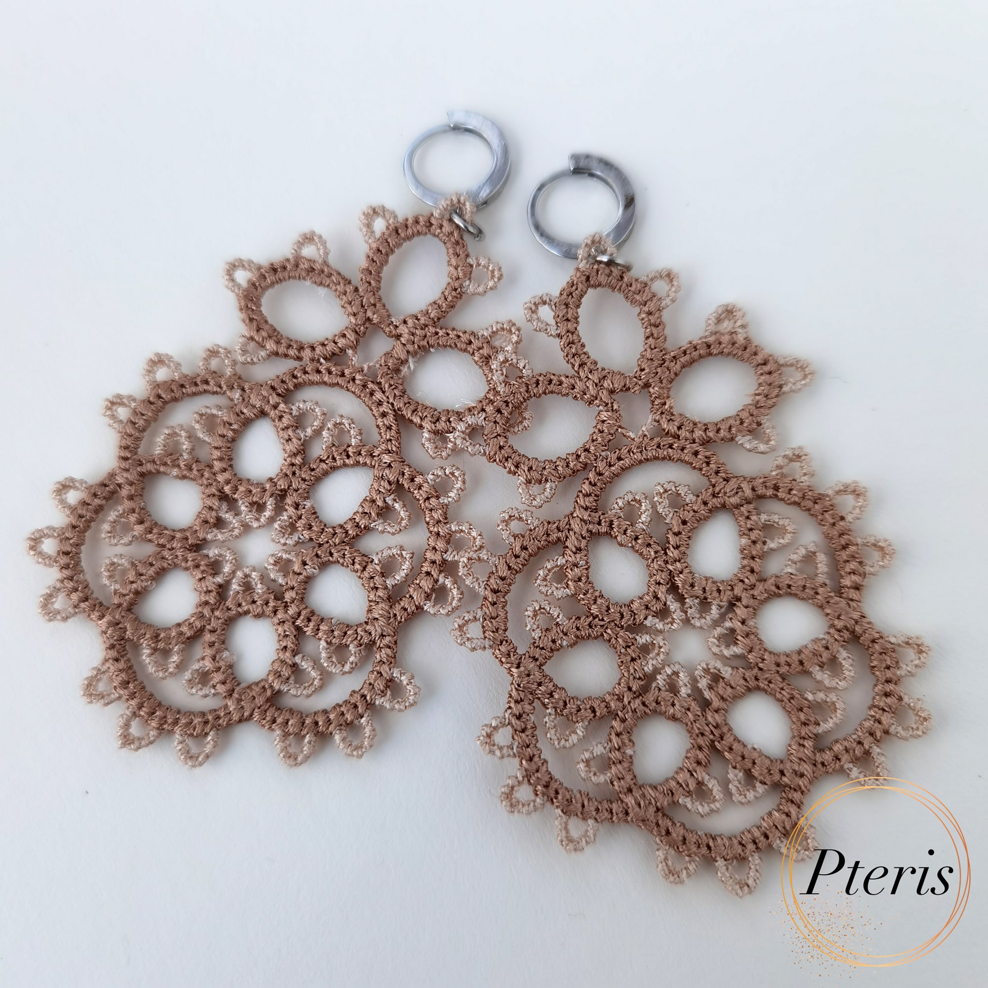 FSL Tatting Earrings Embroidery Design featuring a pair of intricate, teardrop-shaped freestanding lace earrings in a traditional knotted tatting style.