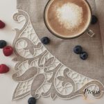Richelieu cutwork napkin corner machine embroidery design showing a close-up of an intricate floral motif stitched in light blue-grey thread on white linen, featuring delicate cutwork lace windows and decorative blue rhinestones.